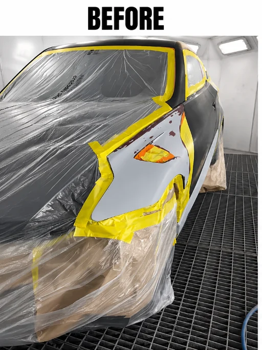 Car fender with body filler, masked, before grey paint repair